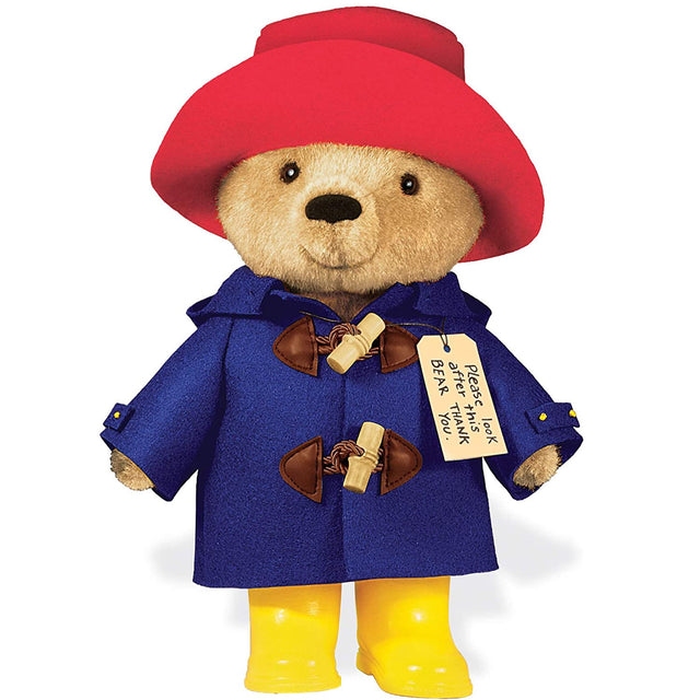 Paddington Bear plush with red hat, blue coat, yellow boots, and iconic "Please Look After This Bear" tag, soft and cuddly.