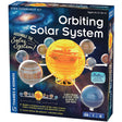 Orbiting Solar System mechanical model kit with colorful planets and sun, teaches planetary orbits and gear mechanics.