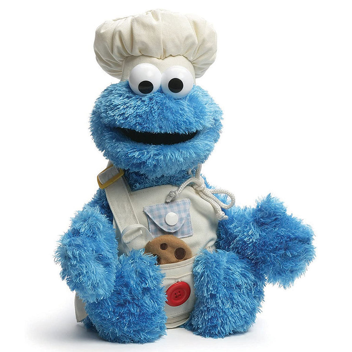 Teach-Me Cookie Monster plush in chef hat and apron holding a cookie, educational toy for dressing skills.
