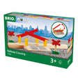 BRIO World Railway Crossing toy with red barrier gates fitting BRIO train tracks for ages 3 and up.