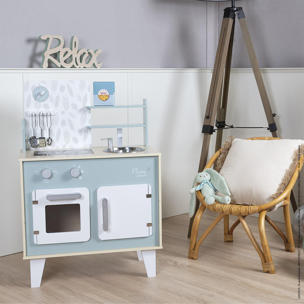 Plume Kitchen Cooker children's wooden play kitchen with induction hob, oven, sink, and hanging utensils in blue and grey.