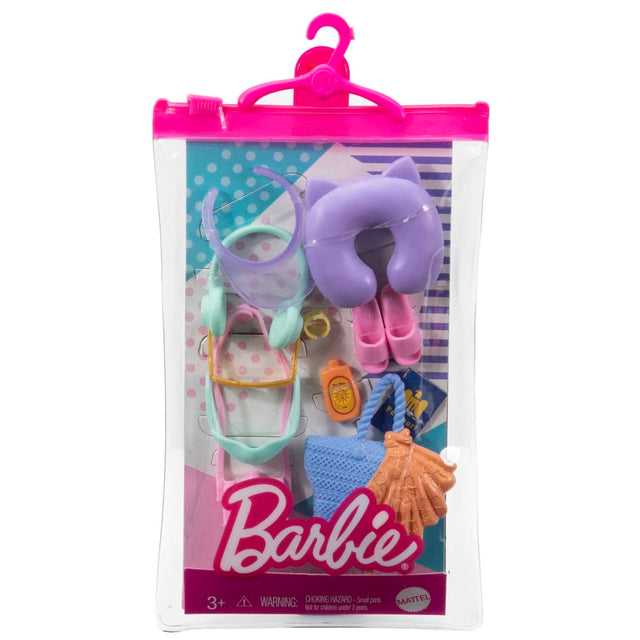Barbie Fashion Accessories with travel-themed hats, bags, shoes, and neck pillow in a pink hanging case.