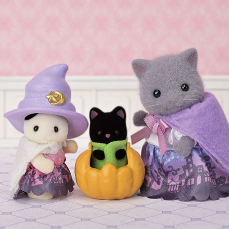 Halloween Surprise Party Set with three Calico Critters in Halloween costumes including a witch and pumpkin outfit.