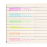 Oh My Glitter! Liquid Glitter Highlighters swatches in neon colors with sparkly glitter ink on lined notebook pages.