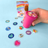 Depiction of child using the rainbow sticker stamper on a sheet of paper. For ages 3 and up.