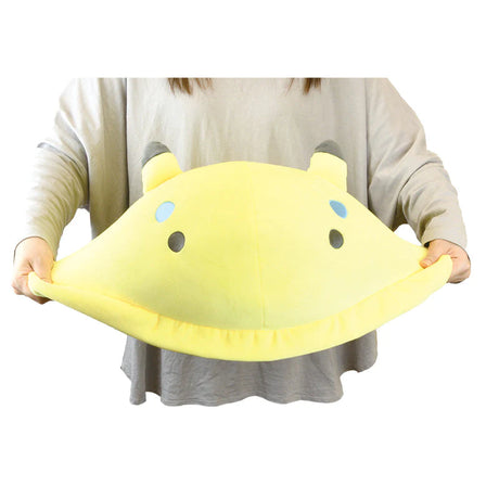 Person holding a soft, colorful, and cuddly yellow Jumbo Sea Slug plush pillow approximately 19 inches long.