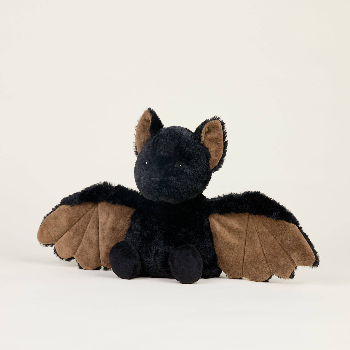 Soft plush bat toy with outstretched wings, microwavable for warmth and scented with dried lavender for comfort.