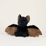 Soft plush bat toy with outstretched wings, microwavable for warmth and scented with dried lavender for comfort.