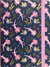 Journal cover with playful pink axolotls and gold foil seaweed pattern on dark blue background with pink elastic band closure