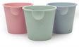 Three pastel-colored Scrunch Mini Bath Buckets in pink, green, and blue, perfect for bath or beach fun.