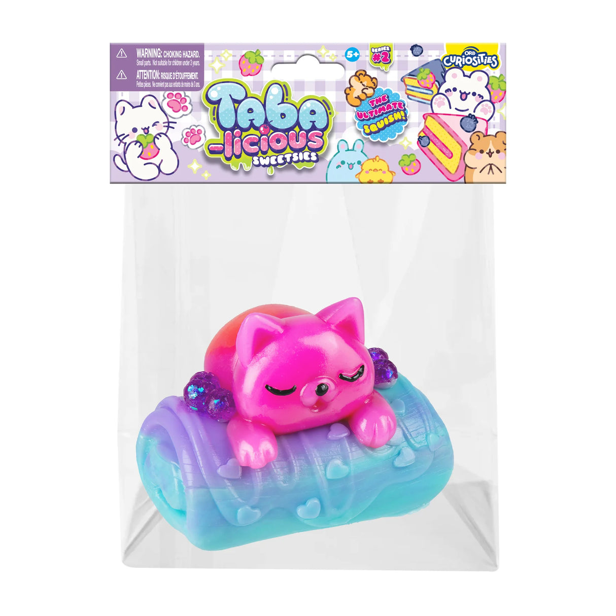 Taba-licious Sweetsies Squishy featuring a pink sleeping animal on a colorful blue and purple frosting base.