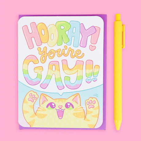 Hooray You're Gay! Card featuring a cheerful cat with rainbow text celebrating Pride Month by Turtle's Soup.