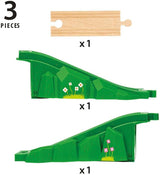 Three-piece arch bridge set with green supports featuring floral details and a wooden track section for train layouts