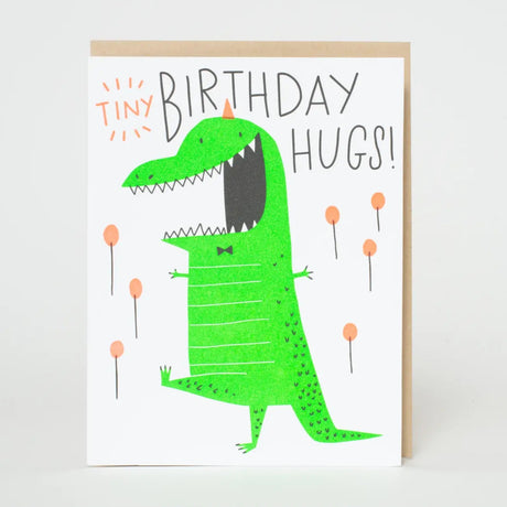 Tiny Birthday Hugs Dino Card featuring a cheerful green dinosaur and playful lettering, letter-pressed in the USA by Egg Press.