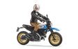 Scrambler Ducati Desert Sled & Driver toy with detailed rider, off-road tires, and blue motorcycle body in 1:16 scale.