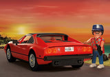 Magnum P.I. Ferrari 308 GTS Quattrovalvole with red Ferrari and Playmobil figure at sunset by the beach road.