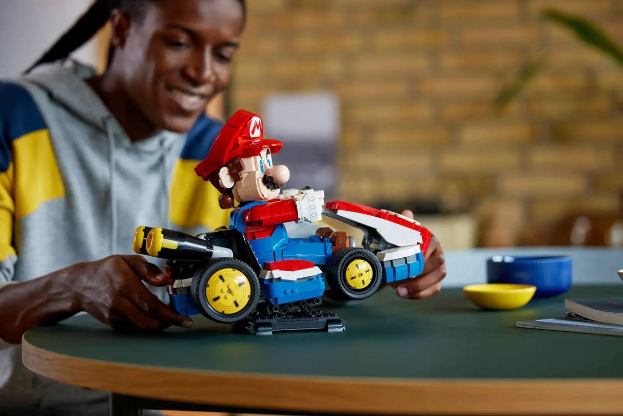 Mario Kart Mario & Standard Kart model with posable Mario figure displayed on a stand, perfect for gaming fans.