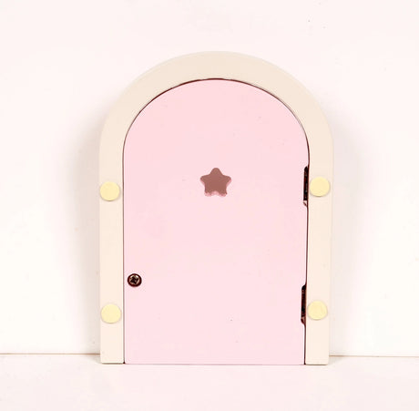 Small wooden fairy door with pale pink panel and star-shaped cutout on white background