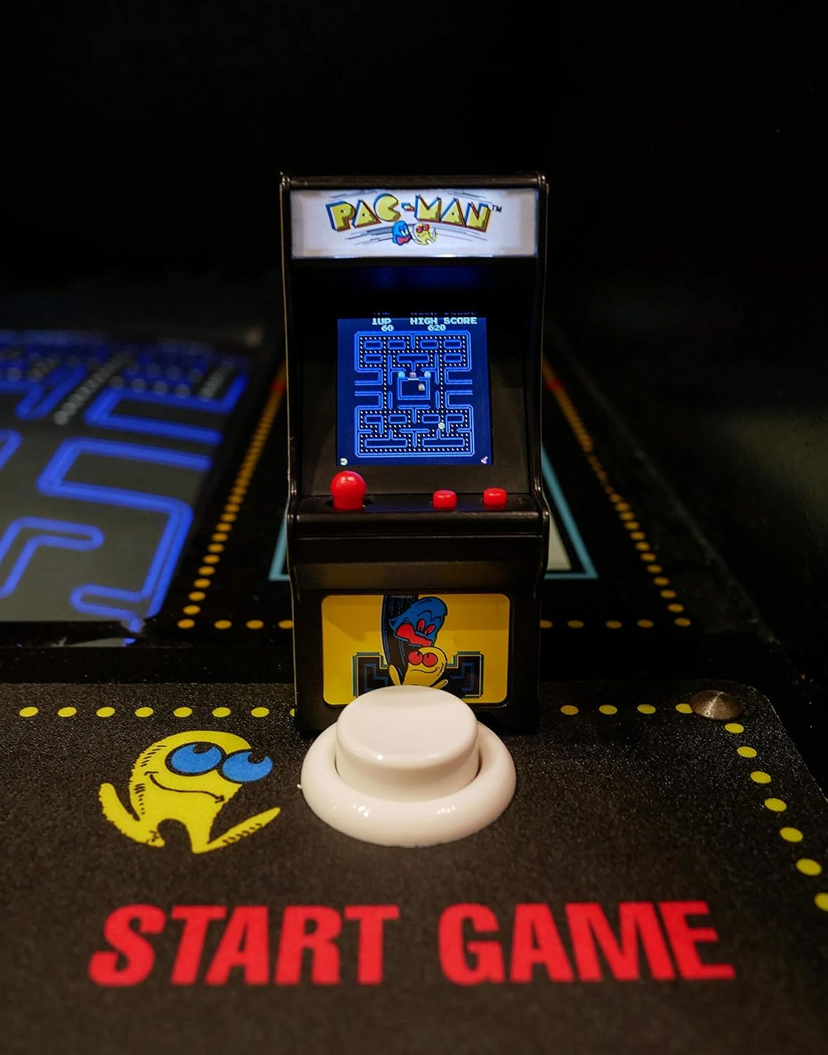Tiny Arcade Pacman shows a miniature arcade game with joystick and screen displaying Pac-Man maze gameplay.