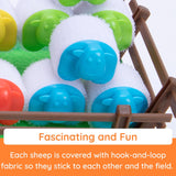 Heap-O-Sheep game showing colorful hook-and-loop sheep stacked in a fenced paddock for launching and piling play.