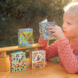 Very Small Journal | Gemma pocket-sized journals with fairy illustrations, metal locks, and sustainable materials on wooden table.