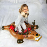 Woman sitting on a Rad Reindeer Snow Tube ready for a fun and comfy ride down a snowy hill.