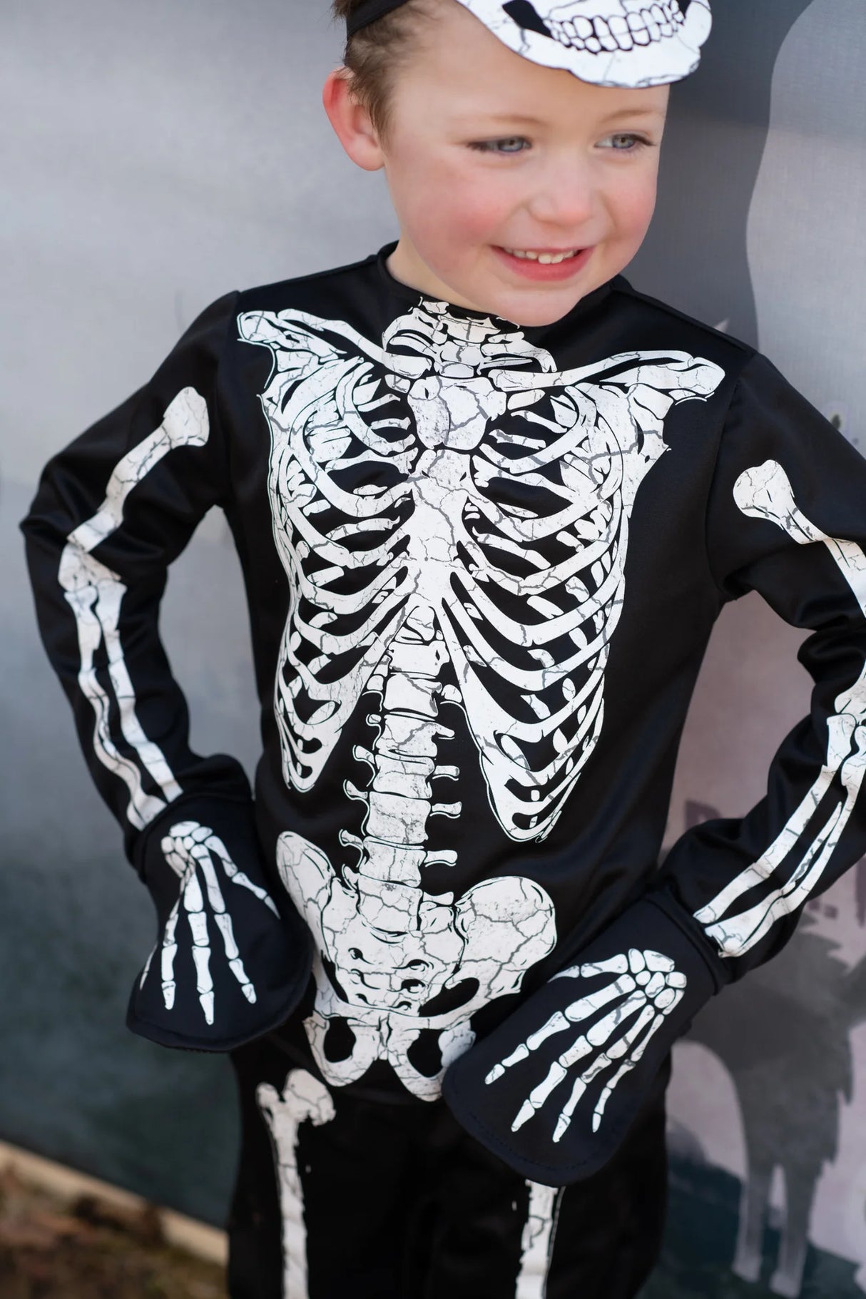 Child wearing the Skeleton Outfit | Size 5-6 with glow-in-the-dark skeleton design on shirt, pants, and mask.