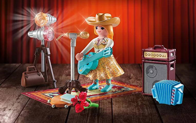 Family Fun | Country Singer Playmobil set with singer figure, microphone, guitar, amplifier, bouquet, and musical accessories on stage.