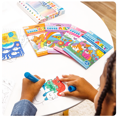 Child coloring dog illustrations in Undercover Art | Dog Days hidden pattern activity set.