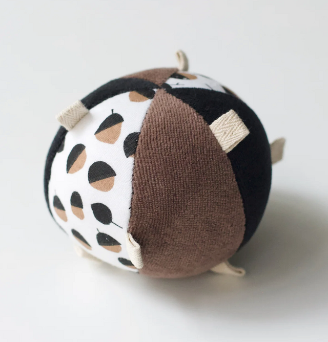 Organic Taggy Ball with Rattle | Acorn features high-contrast patterns and textures for sensory play and auditory stimulation.