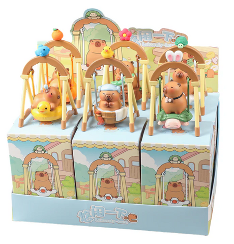 Capybara Swing Blind Box with cute capybara figures on swings, each featuring different playful accessories and animals.