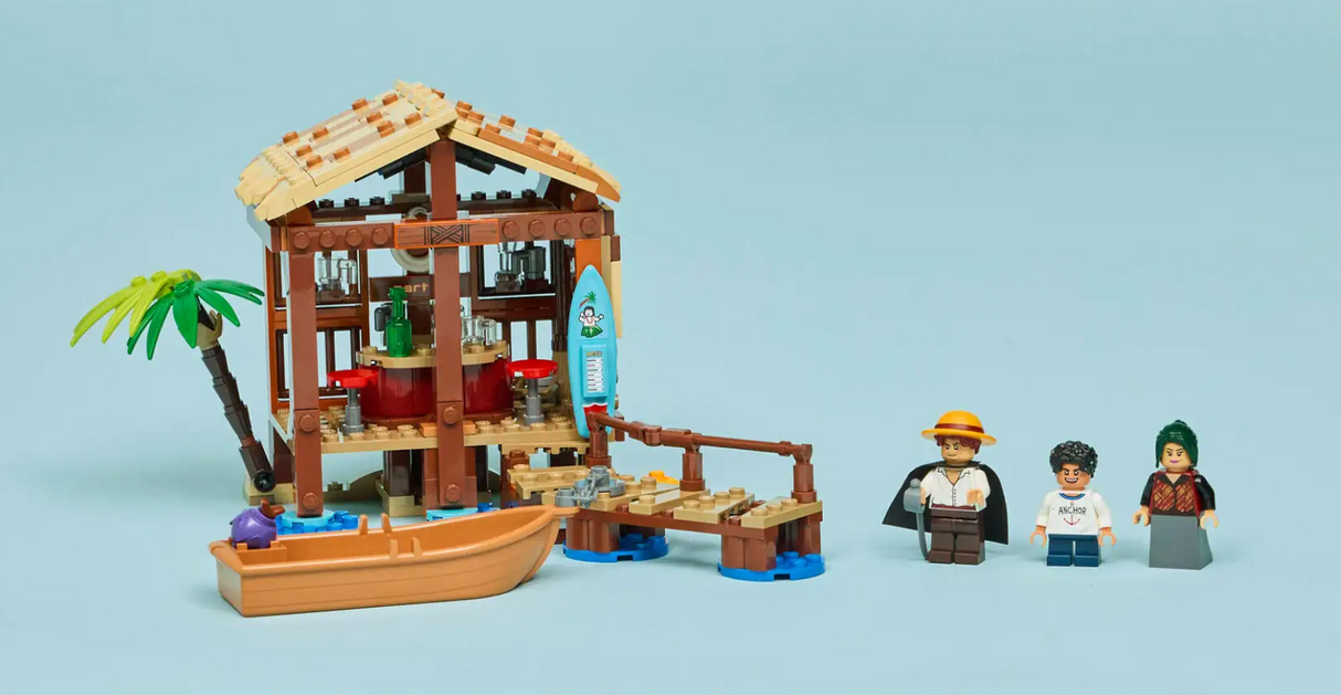 ONE PIECE Windmill Village Hut LEGO set with removable roof, pirate boat, palm tree, and three minifigures.