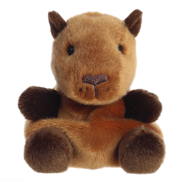 Soft brown plush capybara with dark paws and a small stitched nose, sitting with a thoughtful expression.