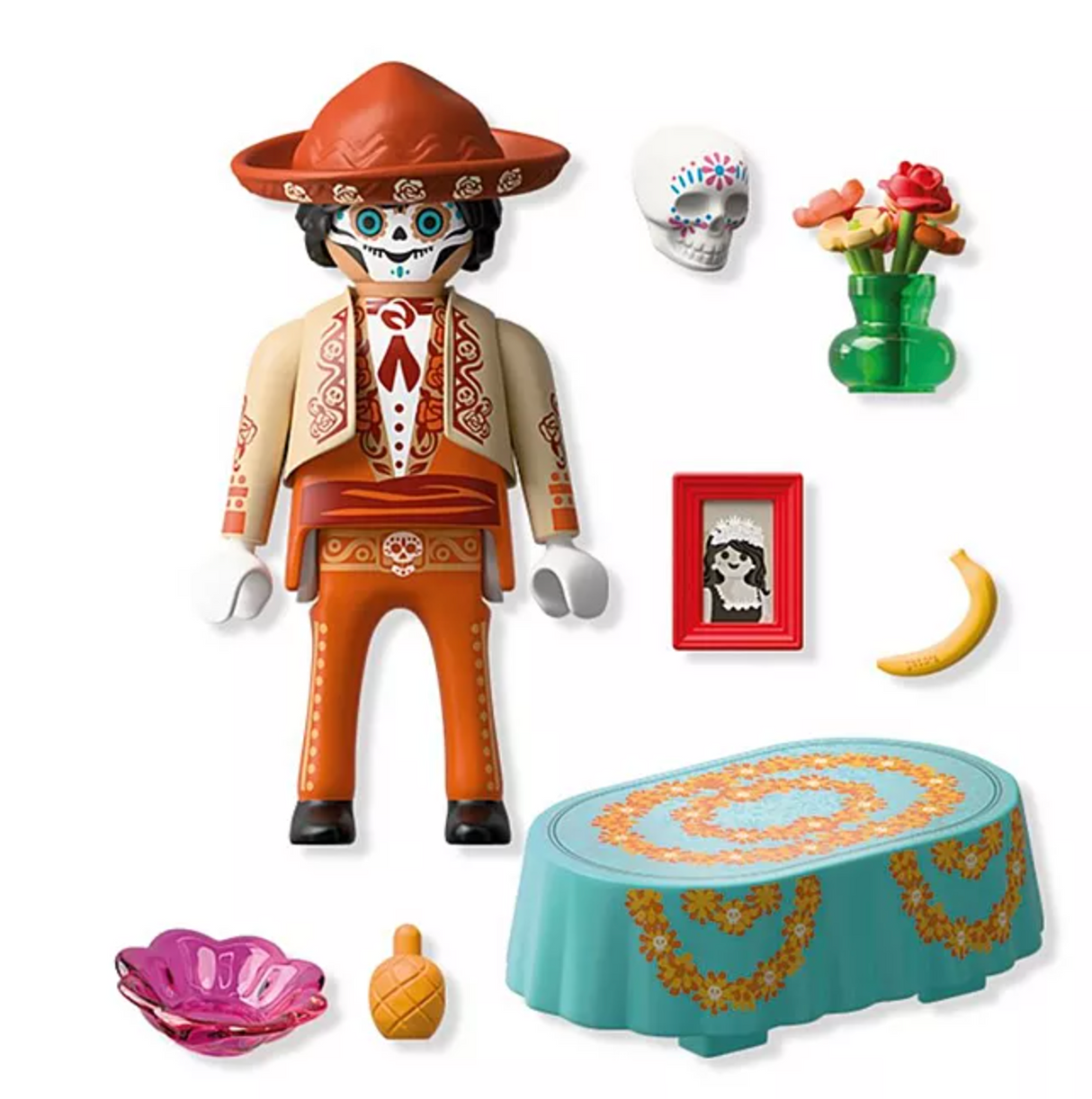 Playmobil Día de los Muertos figure with decorative table, skull, flowers, fruit, picture frame, and accessories for celebration.