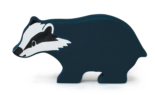 Smooth natural wooden toy shaped like a friendly little badger, perfect for imaginative play and storytelling.