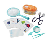 Children's bug catching kit with net, magnifying glass, tweezers, bug container, and insect identification cards for outdoor adventure.