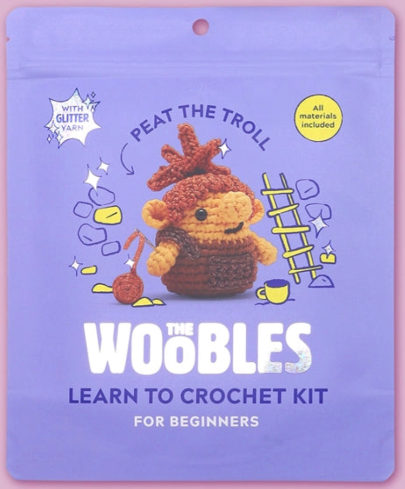 Peat the Troll crochet kit packaging with colorful design and glitter yarn included for beginner crafters.