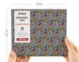 Hands holding a 7x6 inch Grabie drawing pad with 20 assorted color sheets and a colorful abstract cover design