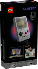 LEGO brick-built Game Boy model with screen, controls, and interchangeable game cartridges on display stand