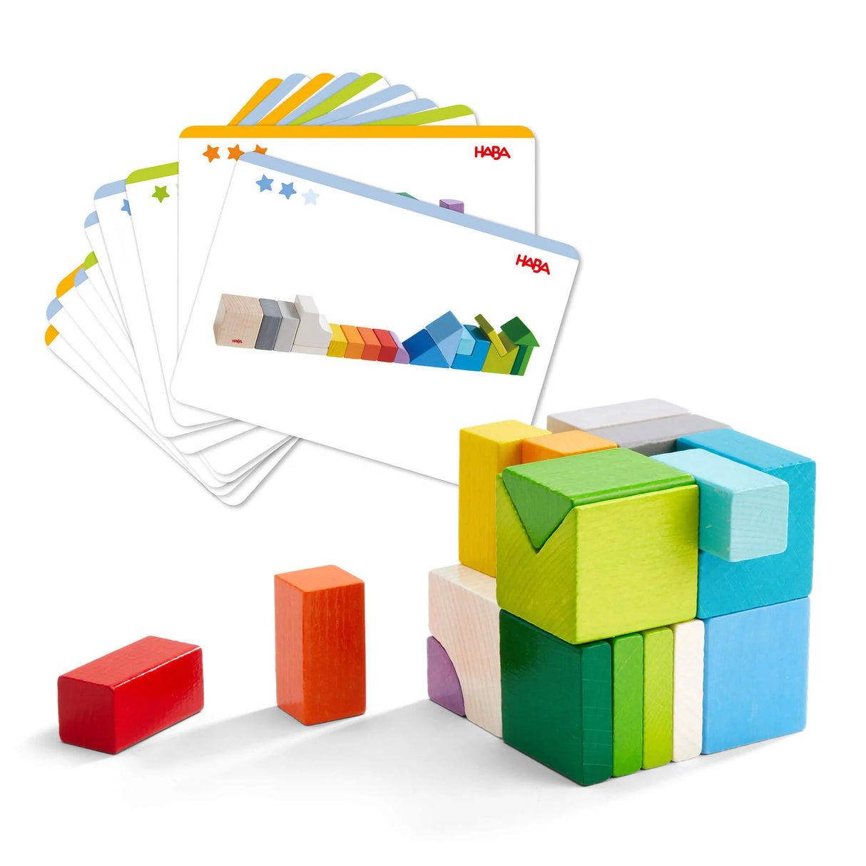 Colorful wooden blocks arranged in a cube next to cards showing stacking patterns for creative play and learning