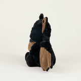 Soft plush bat toy with black and brown fur, designed for soothing warmth and comfort with lavender scent.