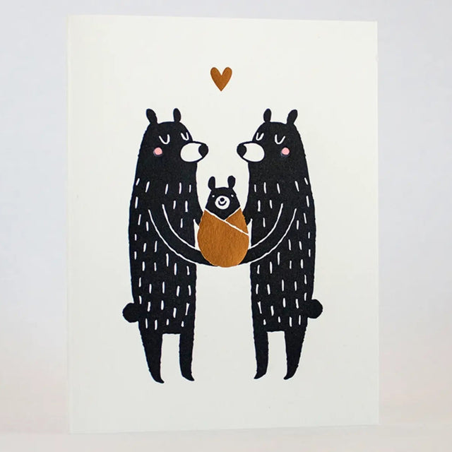 New Baby Black Bears Card showing two parent bears holding a wrapped baby bear with a heart above, letter-pressed by Fugu Fugu!