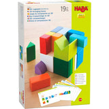 Colorful wooden blocks arranged in 3D shapes with cards showing different stacking patterns for creative play