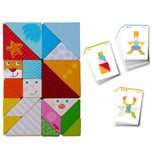 Colorful wooden tangram puzzle pieces with funny faces next to laminated cards showing design ideas for creative play.