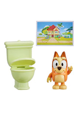 Bluey Figure Story Starter Series 11 with poseable Bluey figure, green toilet accessory, and house story backdrop.