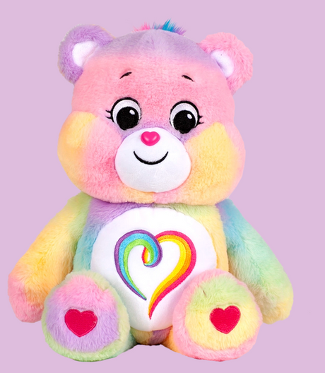 Care Bears 14in plush bear with colorful fur, heart-shaped belly badge, and friendly smiling face for kids 3 and up.