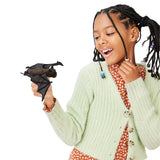 Girl playing with a Bat Finger Puppet, showing detailed wings and a sweet face for imaginative storytelling.