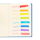Mighty Mega Markers showing vibrant washable colors with thin and thick lines on an open sketchpad.