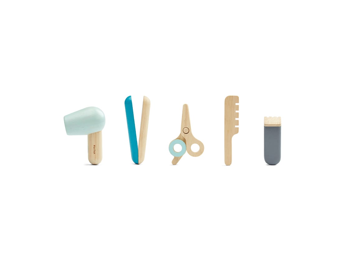 Hair Dresser Set toy featuring a mini hair dryer, straightener, scissors, comb, and clip for imaginative play.