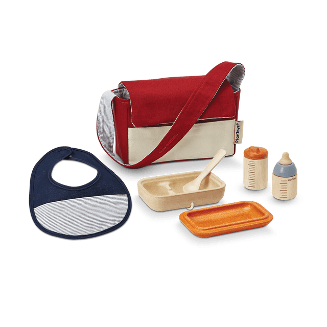 Doll Feeding Set with a red and beige bag, bib, spoon, food container, water bottle, and feeding bottle for pretend play.